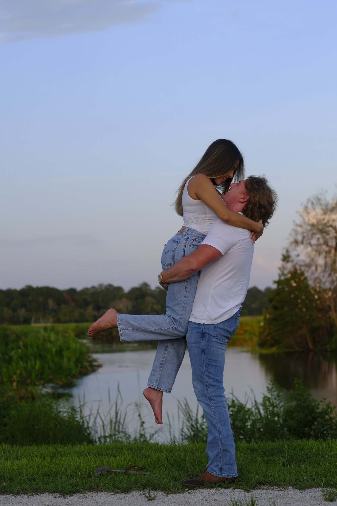 Couple lift by the lake